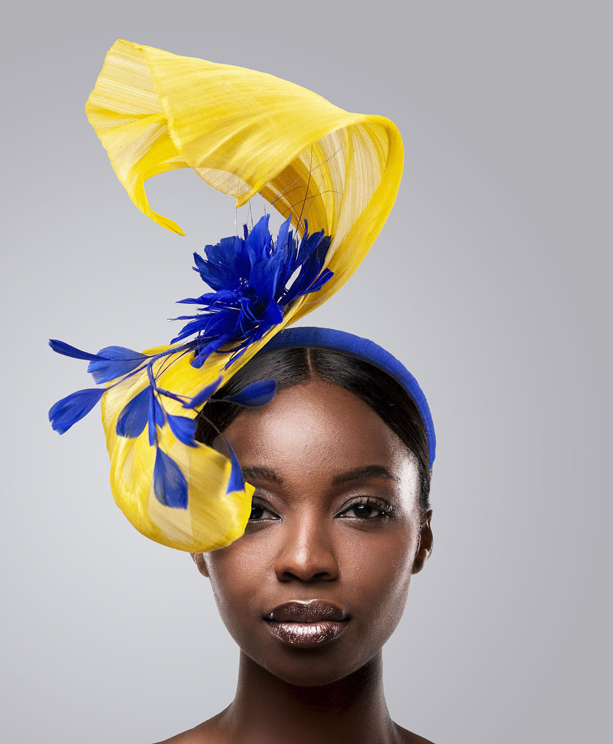 Yellow wave with royal blue fascinator